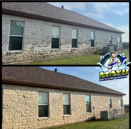 Stone house wall, before and after a house wash