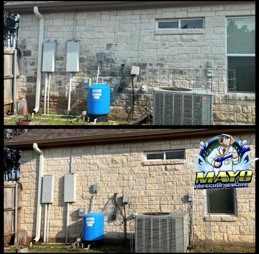 Limestone wall behind the AC unit, before and after a wash