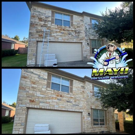 Front of a two-story stone house, before and after a house wash