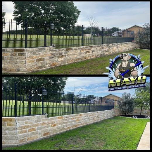 Stone retaining wall along a fence, before and after