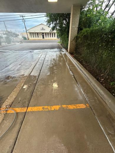 Covered drive at a business, mid-wash