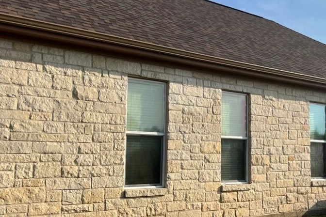 The same wall washed back to warm limestone