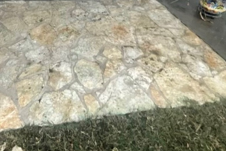 The same flagstone patio back to its natural color